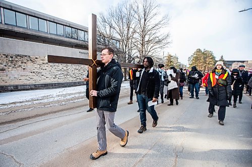 MIKAELA MACKENZIE / FREE PRESS

Justin Mall (front) and Paul Bahiga lead the Way of the Cross procession to the second station of the cross at the University of Manitoba on Friday, March 29, 2024. This is the first year that the event has been held on a university campus.

For Katie story.