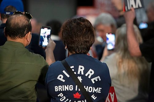 BROOK JONES / FREE PRESS
Supporters cheer and video record with cellphones Conservative Party of Canada Leader Pierre Poilievre while he makes his way to the stage for his 'Spike the Hike - Axe the Tax' rally at the RBC Convention Centre in Winnipeg, Man., Thursday, March 28, 2024.