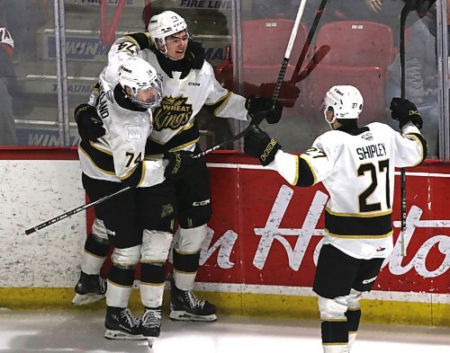 Brandon Wheat Kings forward Roger McQueen (13) celebrates his second period goal against the Moose Jaw Warriors in Game 2 at the Moose Jaw Events Centre on Saturday with Brett Hyland (74) and Luke Shipley (27). The Wheat Kings find themselves in a hole after dropping the first two games of the best-of-seven Eastern Conference quarterfinal series. (Perry Bergson/The Brandon Sun)