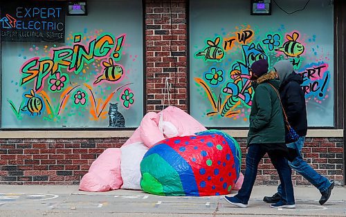 JOHN WOODS / FREE PRESS
People walk past a deflated Easter bunny outside a business on Portage Avenue  Sunday, March 31, 2024. 

Reporter: standup
