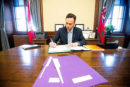 MIKAELA MACKENZIE / FREE PRESS

New Finance minister Adrien Sala signs documents in his office at the Manitoba Legislative Building on Thursday, March 28, 2024. 

For Dan story.