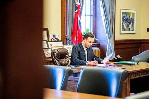 MIKAELA MACKENZIE / FREE PRESS

New Finance minister Adrien Sala signs documents in his office at the Manitoba Legislative Building on Thursday, March 28, 2024. 

For Dan story.