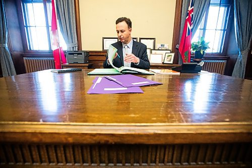 MIKAELA MACKENZIE / FREE PRESS

New Finance minister Adrien Sala signs documents in his office at the Manitoba Legislative Building on Thursday, March 28, 2024. 

For Dan story.