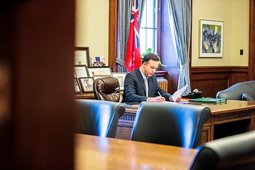 MIKAELA MACKENZIE / FREE PRESS

New Finance minister Adrien Sala signs documents in his office at the Manitoba Legislative Building on Thursday, March 28, 2024. 

For Dan story.