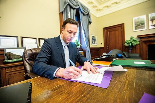 MIKAELA MACKENZIE / FREE PRESS

New Finance minister Adrien Sala signs documents in his office at the Manitoba Legislative Building on Thursday, March 28, 2024. 

For Dan story.