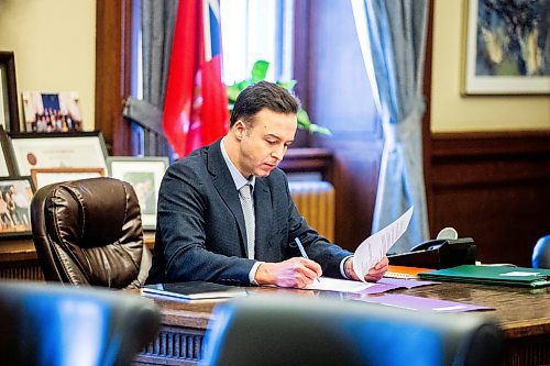 MIKAELA MACKENZIE / FREE PRESS

New Finance minister Adrien Sala signs documents in his office at the Manitoba Legislative Building on Thursday, March 28, 2024. 

For Dan story.