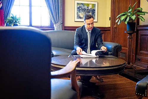 MIKAELA MACKENZIE / FREE PRESS

New Finance minister Adrien Sala looks over the budget binder in his office at the Manitoba Legislative Building on Thursday, March 28, 2024. 

For Dan story.