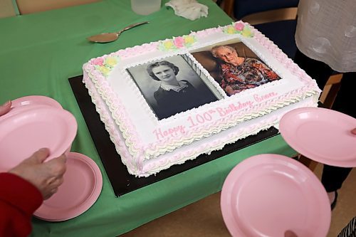 Cake is cut for Hobbs Manor resident Grace Bell during a party for her 100th birthday on Tuesday. (Tim Smith/The Brandon Sun)