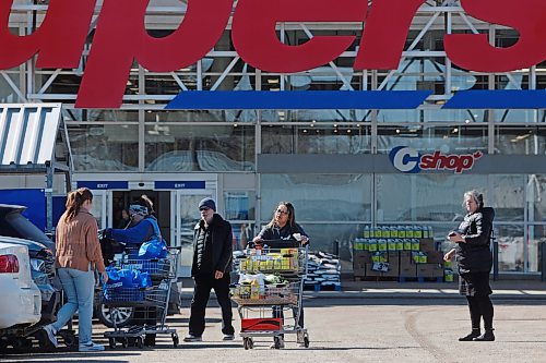 Shoppers come and go from the Superstore in Brandon on Tuesday. According to Statistics Canada, the average amount spent by Canadians on retail groceries in January dropped below $250 per month — a 19 per cent decrease from January 2021. (Tim Smith/The Brandon Sun)