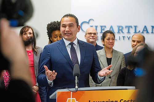 Premier Wab Kinew and Health, Seniors and Long-Term Care Minister Uzoma Asagwara make an announcement during a press conference on Wednesday in Winnipeg. The premier's plan to hire health-care workers will rely heavily on recruiting graduates. (Mike Deal/Winnipeg Free Press)