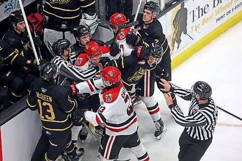 Brandon Wheat Kings and Moose Jaw Warriors players skirmish in front of the Wheaties bench during the second period of game three of first-round playoff action at Westoba Place on Wednesday evening. See story on Page B1. (Tim Smith/The Brandon Sun)