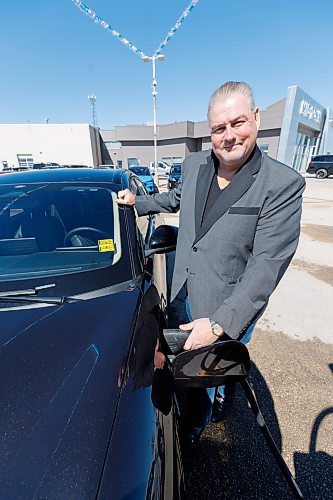 MIKE DEAL / FREE PRESS
Scott Campbell, owner of Mid-Town Ford, 1717 Waverley, with a Ford Mustang Mach-E, Wednesday morning. They have had a large number EVs on the lot for some time. Campbell is super happy about the rebate. 
See Martin Cash story
240403 - Wednesday, April 03, 2024.