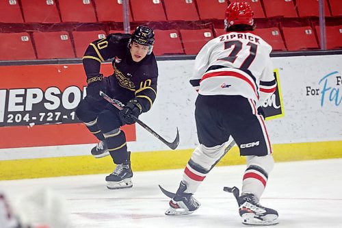 03042023
Caleb Hadland #10 of the Brandon Wheat Kings passes the puck past Aiden Ziprick #21 of the Moose Jaw Warriors during the first period of game three of first round playoff action at Westoba Place on Wednesday evening. 
(Tim Smith/The Brandon Sun)