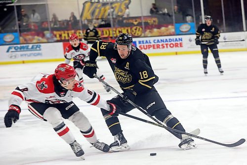 03042023
Rylen Roersma #18 of the Brandon Wheat Kings tries to move the puck past Kalem Parker #8 of the Moose Jaw Warriors during the first period of game three of first round playoff action at Westoba Place on Wednesday evening. 
(Tim Smith/The Brandon Sun)
