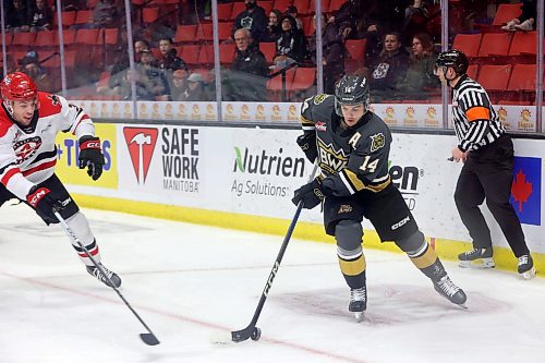 03042023
Jayden Wiens #14 of the Brandon Wheat Kings plays the puck during the first period of game four of first round playoff action against the Moose Jaw Warriors at Westoba Place on Wednesday evening. 
(Tim Smith/The Brandon Sun)