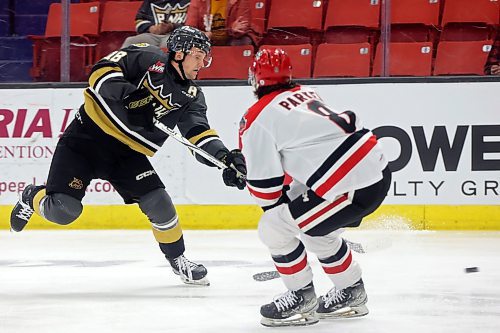 03042023
Rylen Roersma #18 of the Brandon Wheat Kings fires a shot on net as Kalem Parker #8 of the Moose Jaw Warriors looks on during the first period of game four of first round playoff action at Westoba Place on Wednesday evening. 
(Tim Smith/The Brandon Sun)