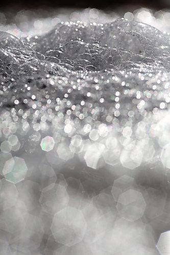 Bubbles glinting in the bright sunshine go with the flow on top of meltwater in a ditch down Grandvalley Road west of Brandon on Friday morning. (Matt Goerzen/The Brandon Sun)