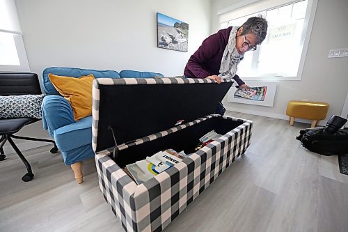 Glendale Homes park owner Cindy Choy shows the storage space in a bench, one of several space-saving pieces of furniture in a newly-constructed single-bedroom home on Brandon's North Hill, to show the storage space under the mattress. Choy advertises the park as Brandon's first Pocket Neighbourhood, with small energy-efficient homes that come with highly insulated walls, roofs and floors, LED lighting, triple-pane windows, and modern equipment for those who want efficient, green living. (Matt Goerzen/The Brandon Sun)