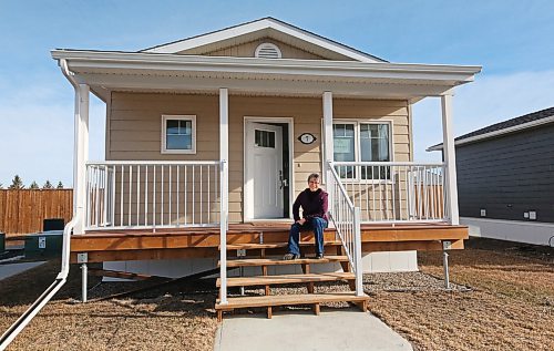 Glendale Homes park owner Cindy Choy sits on the steps of a newly-constructed single-bedroom home on Brandon's North Hill. Choy advertises the park as Brandon's first Pocket Neighbourhood, with small energy-efficient homes that come with highly insulated walls, roofs and floors, LED lighting, triple-pane windows, and modern equipment for those who want efficient, green living. (Matt Goerzen/The Brandon Sun)