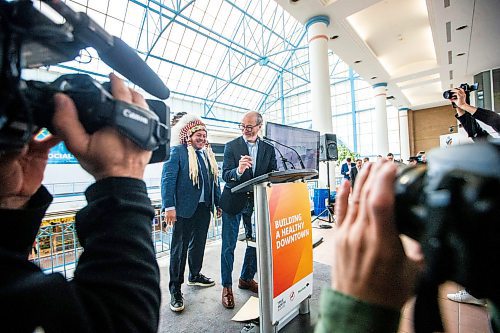 MIKAELA MACKENZIE / FREE PRESS
SCO grand chief Jerry Daniels (left) and True North Real Estate Development president Jim Ludlow sign a letter of understanding at Portage Place after a press conference announced new redevelopment details for the space on Friday, April 5, 2024.
For Chris story.