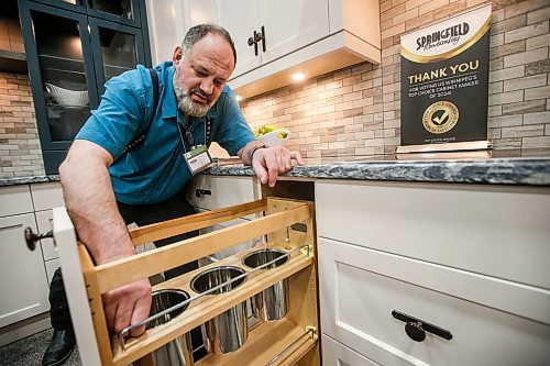 JOHN WOODS / FREE PRESS
Pauly Kleinsasser, CEO, Springfield Woodworking, puts the final touches on a cabinet at the Home and Garden Show at the Convention Centre Sunday, April 7, 2024. 

Reporter: standup