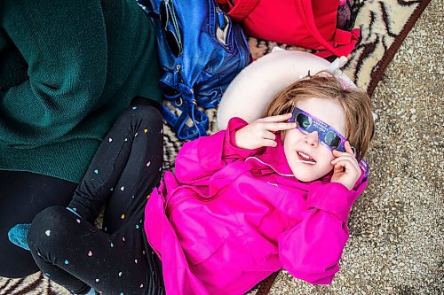 MIKAELA MACKENZIE / FREE PRESS
	
Harmony Davidson (five) looks through her eclipse glasses during the solar eclipse viewing party at The Leaf in Assiniboine Park on Monday, April 8, 2024. 

For Nicole story.