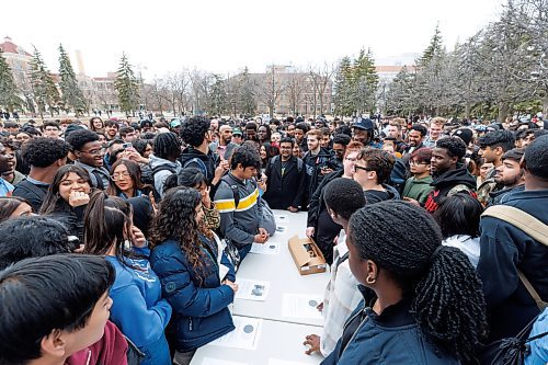 MIKE DEAL / FREE PRESS
Students gather on the Quad at the University of Manitoba to collect free viewing glasses and watch the partial solar eclipse during an overcast Monday afternoon.
240408 - Monday, April 08, 2024.