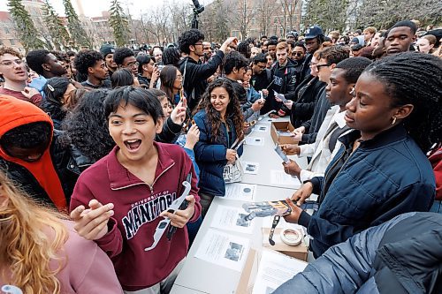 MIKE DEAL / FREE PRESS
Students gather on the Quad at the University of Manitoba to collect free viewing glasses and watch the partial solar eclipse during an overcast Monday afternoon.
240408 - Monday, April 08, 2024.