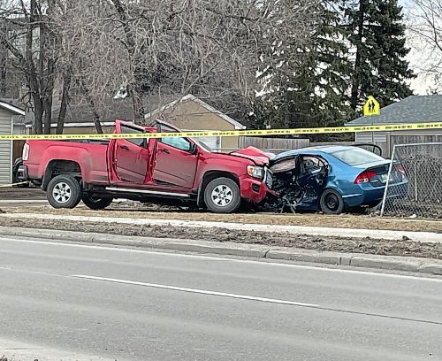 A two-vehicle collision at the intersection of Dunkirk and Parkville drives Monday. (Ruth Bonneville / Free Press) 

