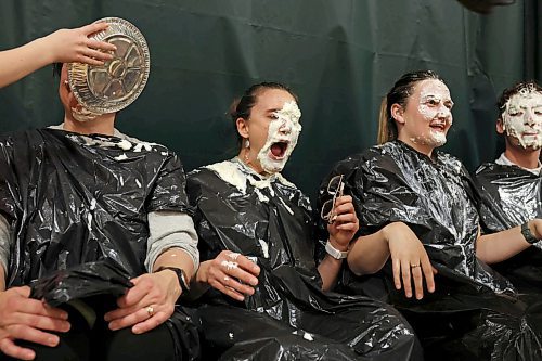 École Harrison staff members react to being pied during a fundraiser for student Jesse Olson’s family at École Harrison on Tuesday. After a battle with cancer, Olson is now cancer-free. Students at the school donated money for the chance to be picked to pie staff members with whip-cream pies during the assembly. (Tim Smith/The Brandon Sun)