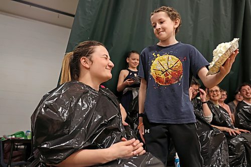09042024
Eleven-year-old grade-six student Jesse Olson pies his teacher Brady Skinner during a fundraiser for Olson&#x2019;s family at &#xc9;cole Harrison on Tuesday. After a battle with cancer, Olson is now cancer-free. Students at the school donated money for the chance to be picked to pie staff members with whip-cream pies during the assembly. 
(Tim Smith/The Brandon Sun)