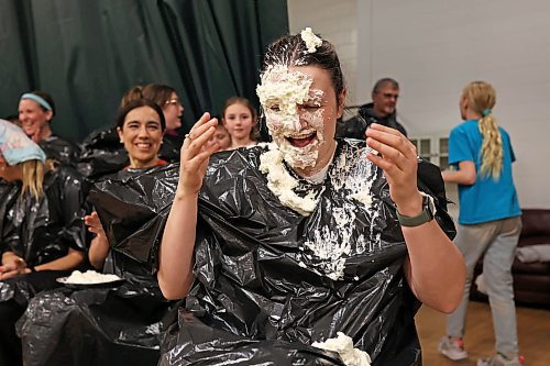 09042024
&#xc9;cole Harrison grade six teacher Brady Skinner reacts after being pied by her student Jesse Olson during a fundraiser for Olson&#x2019;s family at &#xc9;cole Harrison on Tuesday. After a battle with cancer, Olson is now cancer-free. Students at the school donated money for the chance to be picked to pie staff members with whip-cream pies during the assembly. 
(Tim Smith/The Brandon Sun)
