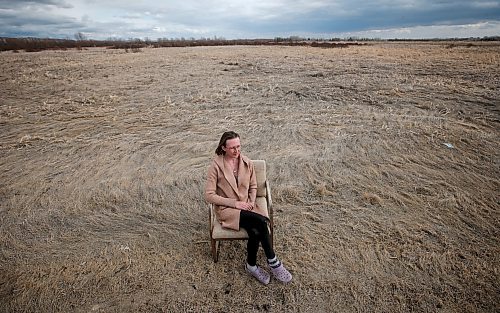 JOHN WOODS / FREE PRESS
Amber Wilson, a resident of Pineridge Village in West Pine Ridge, sits beside the proposed site of a pharmaceutical manufacturer Tuesday, April 8, 2024. Over 1000 residents of the area are opposed to a pharmaceutical company being built on the land near their homes.

Reporter: gabby