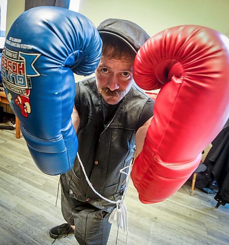 JOHN WOODS / FREE PRESS
David Lafrance poses with a pair of oversized gloves in the lounge at Pan Am Place, a half-way house for men, Tuesday, April 8, 2024. 

Reporter: conrad