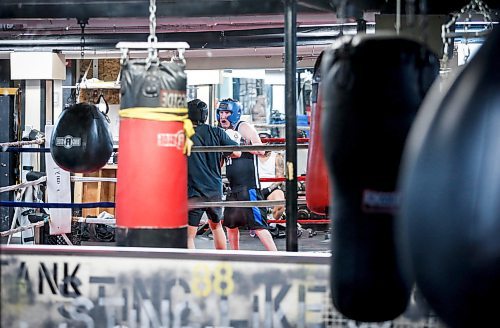 JOHN WOODS / FREE PRESS
Jason Aniceto, left, co-manager, and Brendan Hobson spar at Pan Am Place, a half-way house for men, Tuesday, April 8, 2024. 

Reporter: conrad