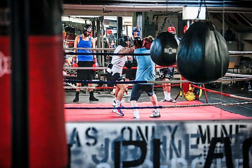 JOHN WOODS / FREE PRESS
Michael McMillan, right, spars against Chris Sarifa, co-manager, at Pan Am Place, a half-way house for men, Tuesday, April 8, 2024. 

Reporter: conrad