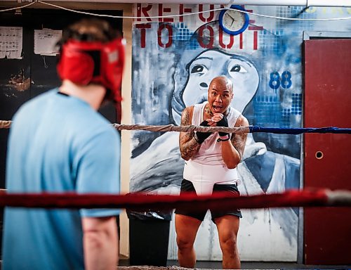 JOHN WOODS / FREE PRESS
Michael McMillan, centre, listens to some ringside coaching from Chris Sarifa, co-manager, right, as he trains at Pan Am Place, a half-way house for men, Tuesday, April 8, 2024. 

Reporter: conrad