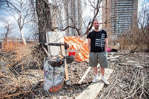 MIKAELA MACKENZIE / FREE PRESS
	
John Larkin (who has lived rough by the river for two years) outside of a friend&#x573; tent along the Assiniboine River on Wednesday, April 10, 2024. A new report to city council estimates that weekly cleanups to all 150 encampments in the city could cost approximately $4.06 million annually. 

For Erik story.