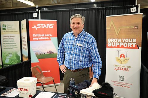 STARS chief medical officer Dr. John Froh stands at the STARS booth during the 2024 Association of Manitoba Municipalities spring convention at the Keystone Centre on Wednesday. (Tim Smith/The Brandon Sun)