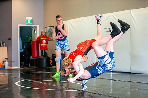 MIKAELA MACKENZIE / FREE PRESS
	
Kaura (top, 17), and Jerin (14) Coles train as Niko Coles (18) watches in Winnipeg on Wednesday, April 10, 2024. The siblings recently medaled at the Canadian amateur wrestling nationals in Ottawa.

For Taylor story.