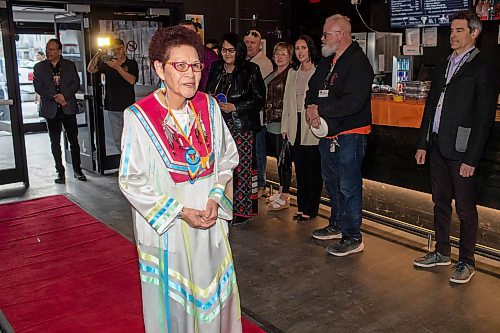 BROOK JONES / FREE PRESS
Elder Betty Ross walking the red carpet before the screening of Return to the Falls, which is a docudrama following the life story of Ross, who is a residential school survivor, at the Park Theatre in Winnipeg, Man., Wednesday, April 10, 2024. The red carpet gala was hosted by Cross Lake First Nation and Black Badge Studios.