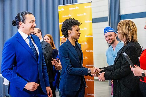 MIKAELA MACKENZIE / FREE PRESS
	
	
Health minister Uzoma Asagwara and premier Wab Kinew shake hands with fellow speakers after announcing a plan to hire 100 more doctors this year at a press conference at the Grace Hospital on Thursday, April 11, 2024.

For Katie story.