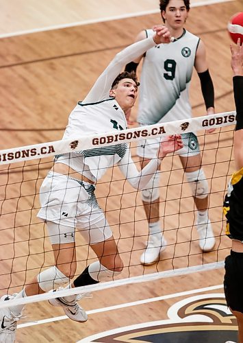 JOHN WOODS / WINNIPEG FREE PRESS
Vincent Massey Trojans&#x2019; Owen Weekes (15) wins the point against the Dakota Lancers in the Manitoba High School 2023 AAAA Varsity Volleyball Provincial Championship at the University of Manitoba Monday, December 4, 2023.