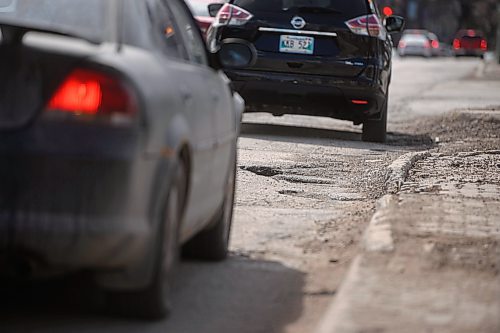 Mike Sudoma / Free Press
Drivers slowly driver through a long line of potholes as they turn from Broadway onto Memorial Blvd Friday afternoon
April 12, 2024