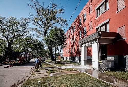 JOHN WOODS / WINNIPEG FREE PRESS
Firefighters wash blood off the street outside 285 College in Winnipeg Monday, September 11, 2023. Winnipeg&#x573; latest murder occurred at this North End location 

Reporter: eric