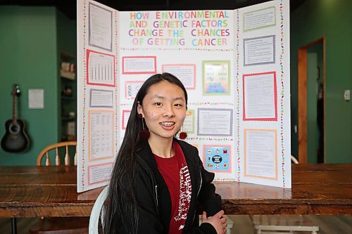 15042024
Angelina Zhang, a grade eight student at &#xc9;cole New Era School, with her science fair project How Environmental and Genetic Factors Change the Chances of Getting Cancer.
(Tim Smith/The Brandon Sun)