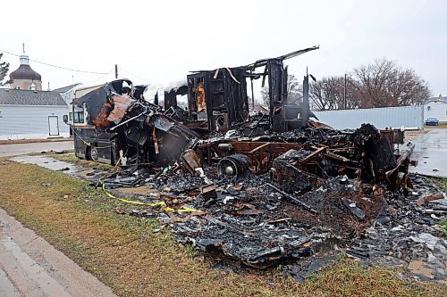 16042024
The burned-out wreckage of a recreational vehicle has been an eyesore along Assiniboine Avenue in Brandon for month&#x2019;s, with debris spilling onto a public sidewalk. 
(Tim Smith/The Brandon Sun)