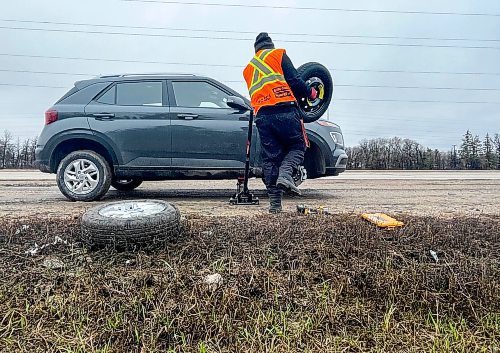 Ruth Bonneville / Free Press
Local - Bishop pot hole
A CAA driver brings a spare tire to a vehicle after impact while flattened it Monday.
A large pot hole in the right hand lane along Bishop Grandin Blvd. ust east of River Road, created a hazard for drivers causing some to get a flat tire upon impact which caused a backup of vehicles Monday.
April 17th, 2024