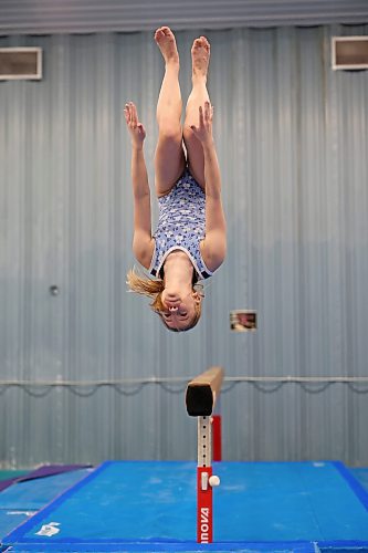 Gymnast Jessie Litviniuk flips off of the balance beam while training at the Brandon Eagles Gymnastics Centre on Thursday. Litviniuk is one of three Eagles gymnasts competing at the Western Canadian Artistic Gymnastics Championships beginning today in Langley, B.C. See story on Page B1. (Tim Smith/The Brandon Sun)