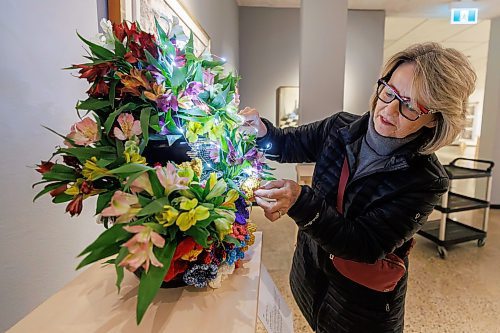 MIKE DEAL / FREE PRESS
Carla Goldstein with WAG-Qaumajuq Associates puts the finishing touches on her arraignment that goes with the huge Jean-Paul Riopelle painting titled Vall&#xe9;e for the Art in Bloom event that is taking place this weekend at the WAG-Qaumajuq.
109 professional and amateur florists will interpret 94 artworks in the WAG-Qaumajuq collection, filling the galleries with fresh flowers.
240418 - Thursday, April 18, 2024.